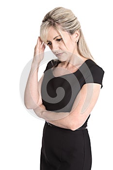 Sad and sorrowful isolated woman in black dress isolated over white.