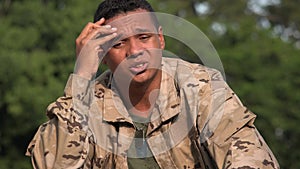 Sad Stressed Hispanic Male Soldier Wearing Camo