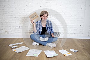 Sad stressed woman with calculator and bank and bills paperwork and documents doing domestic financial accounting