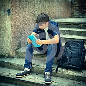 Sad Student with the Book