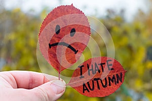 Sad symbol leaf and leaf with inscription text - i hate autumn