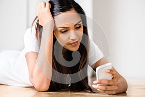 Sad teeange girl video messaging mobile phone photo