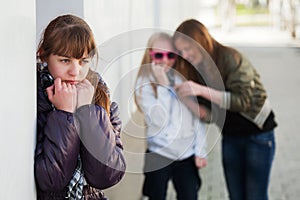 Sad teen girl in depression in city street