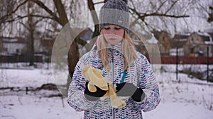 Sad teenage cute girl hugging toy in slow motion looking away thinking. Medium shot front view portrait of upset