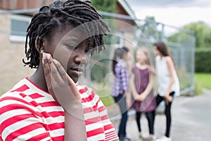 Sad Teenage Girl Feeling Left Out By Friends