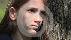 Sad Thoughtful Child by Tree, Unhappy Kid, Depressed Teenager Girl Not Playing, Depression of Adolescents in Coronavirus Pandemic