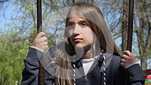 Sad Thoughtful Girl in Swing, Unhappy Child in Park, Depressed Young Kid Not Playing, Depression of Adolescents in Pandemic