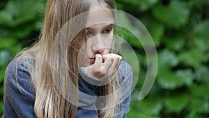 Sad Unhappy Girl in Park, Thoughtful Kid, Depressed Teenager Child Not Playing, Depression of Adolescents in Coronavirus Pandemic