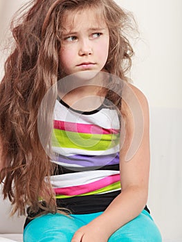 Sad unhappy little girl kid portrait.