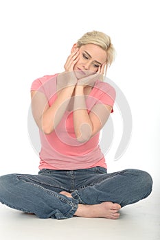 Sad Unhappy Thoughtful Attractive Young Woman Sitting on the Floor