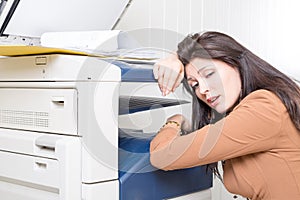 Sad unhappy woman in office with copier printer