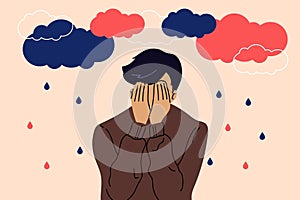 Sad, unhappy young man under dark clouds and rain. Psychology, depression, bad mood. Vector illustration in cartoon style