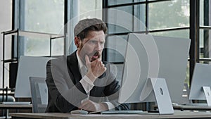 Sad upset mad crazy failure adult bearded Caucasian man in office work angry businessman tired worker problem with