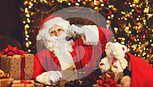 Sad upset santa claus talking on phone