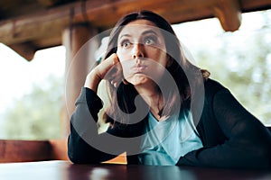 Sad Upset Woman Waiting Alone in a Restaurant Being Stood up