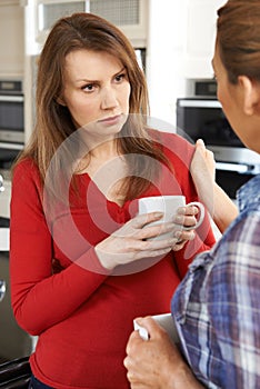 Sad Woman Being Consoled At Home By Female Friend photo