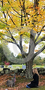 Sad woman in cemetery