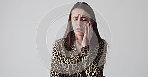 Sad woman crying over white background