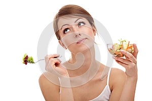 Sad woman on diet with vegetables