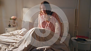 Sad woman feeling unwell lying in bed. Frustrated upset girl feel stomach ache