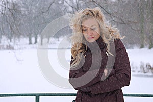 Sad woman freezing in winter