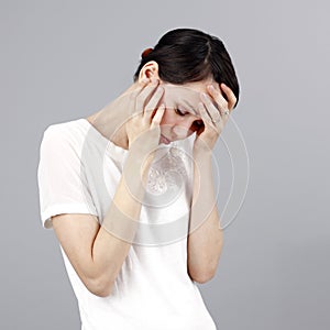 Sad woman isolated on grey background