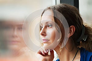 Sad woman looking out window