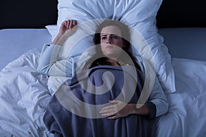 Sad Woman Lying On Bed