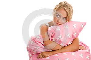 Sad woman with pink pillow