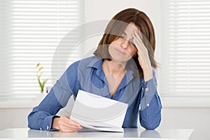 Sad Woman Reading Document