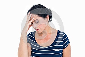 Sad woman sitting with head in hands