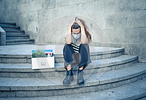 Sad woman sitting outside office feeling hopeless after being fired. Coronavirus job cuts crisis