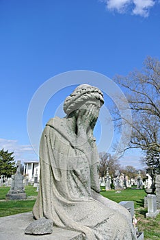 Sad woman sorrow stone figure elegant and tragic