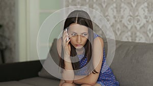Sad Woman Speaking by Phone
