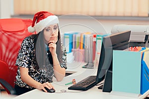 Sad Woman Spending Christmas Holiday at the Office