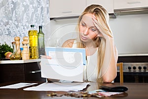 Sad woman thinking about financial problems