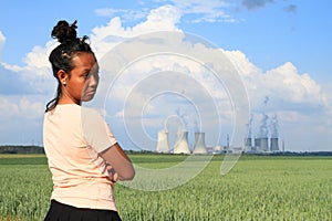 Sad woman watching Nuclear power plant Dukovany photo
