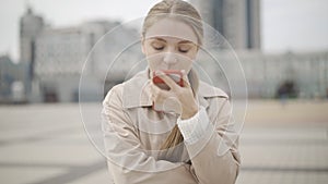 Sad young Caucasian woman arguing with someone on the phone. Portrait of stressed pretty lady yelling on smartphone as