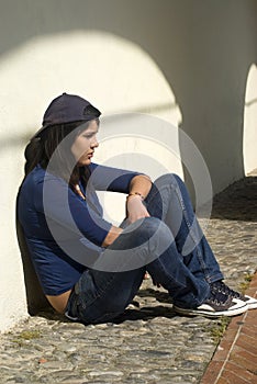 Sad young girl outdoors