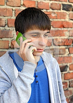 Sad Young Man with Cellphone