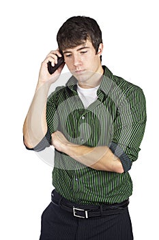 Sad young man on his cell phone