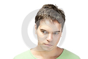 Sad young man isolated on white background