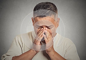 Sad young man looking down