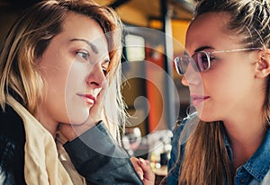 Sad young woman with friend