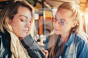 Sad young woman with friend