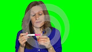 Sad young woman girl holding pregnancy test feeling hopeless