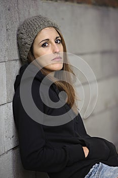 Sad young woman with knitted hat