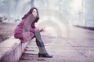 Sad Young Woman Sitting Outdoors