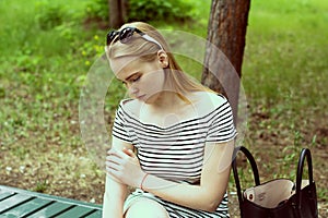 Sad young woman in a striped