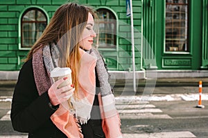 Sad young woman in warm clothing